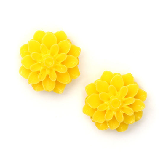 Yellow dahlia flower with gold-tone clip earrings