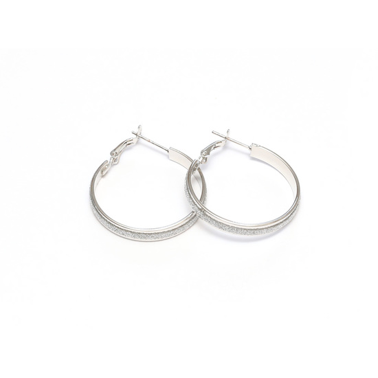 Silver tone hoop earrings with silver glitter