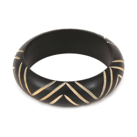 Black wooden bangle with carved chevron pattern